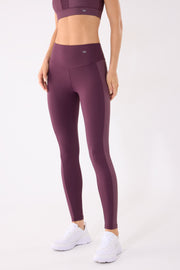 Leggings deportivos largos con banda metalizada burdeos