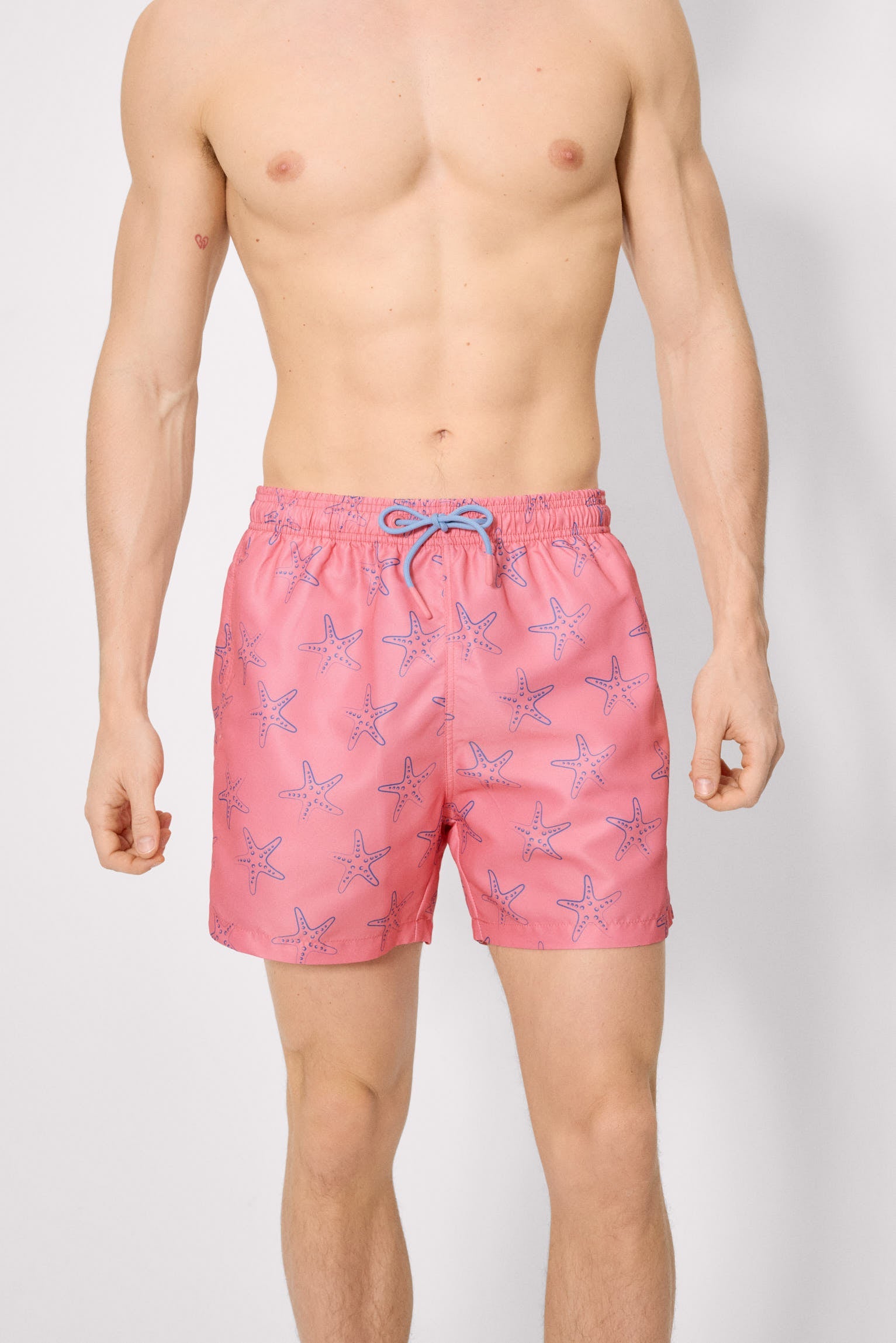 Bañador medio estampado estrellas mar rosa