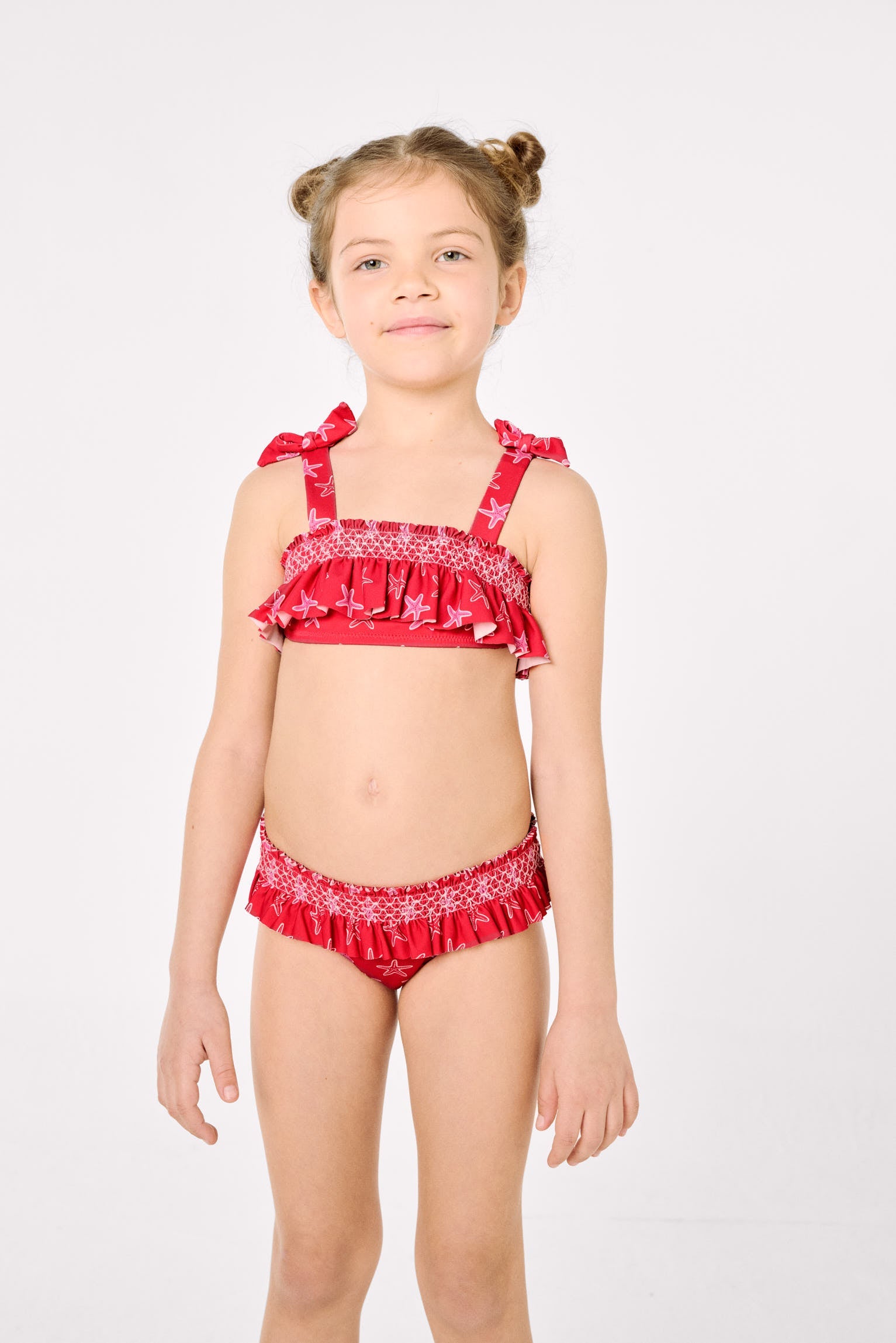 Bikini niña detalles volantes y nido de abeja estampado estrellas marinas