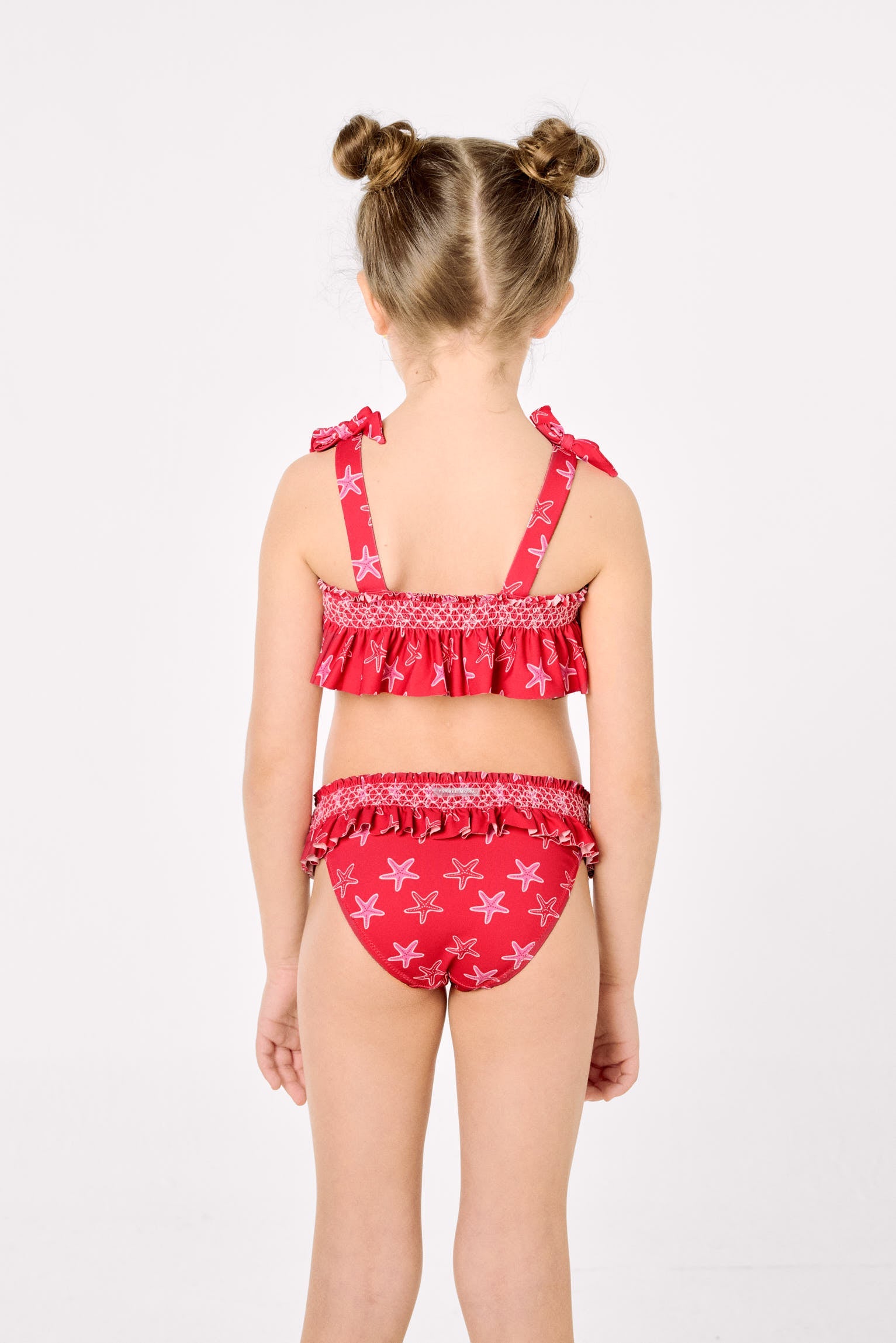 Bikini niña detalles volantes y nido de abeja estampado estrellas marinas